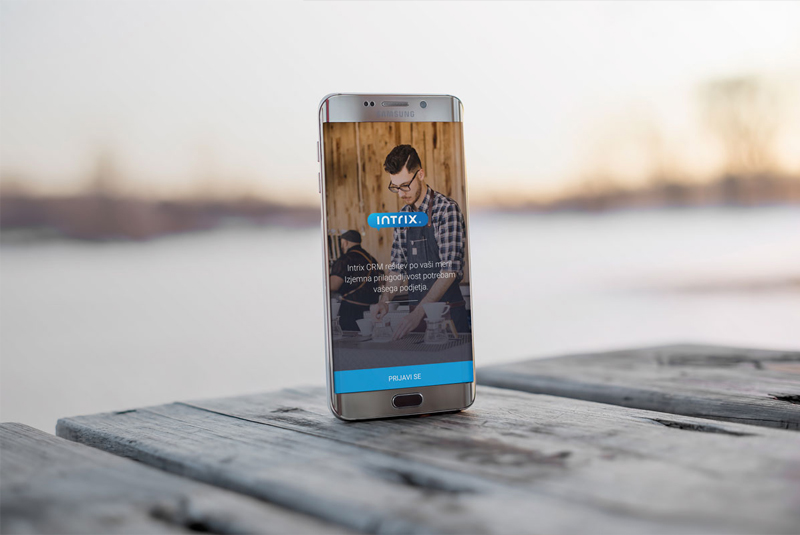 Android-Phone-On-Wooden-Table-Mockup-PSD