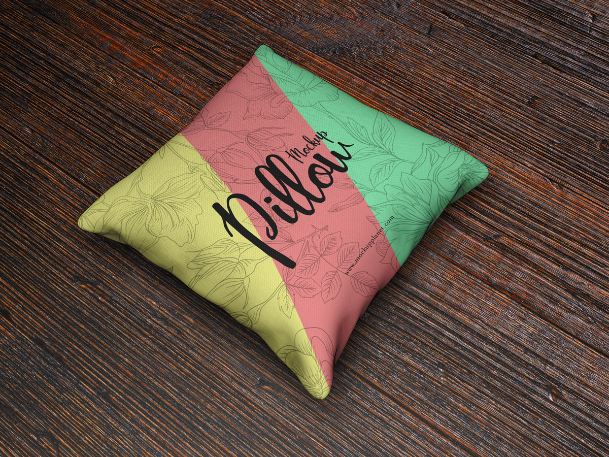 Free-PSD-Square-Pillow-Mockup-on-Wooden-Background-2018
