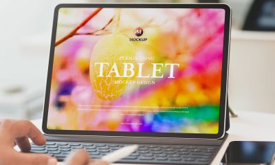 Free-Person-Using-Tablet-Mockup-Design