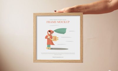 Free-Woman-Showing-Wooden-Square-Frame-Mockup-Design