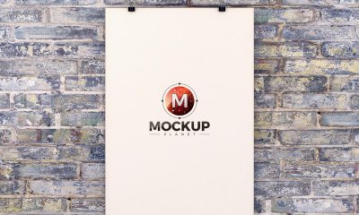 Free-Poster-Hanging-Over-Brick-Wall-Mockup-PSD