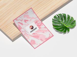 Free Curved Poster Placing on Wooden Sheet Mockup Design - Mockup Planet