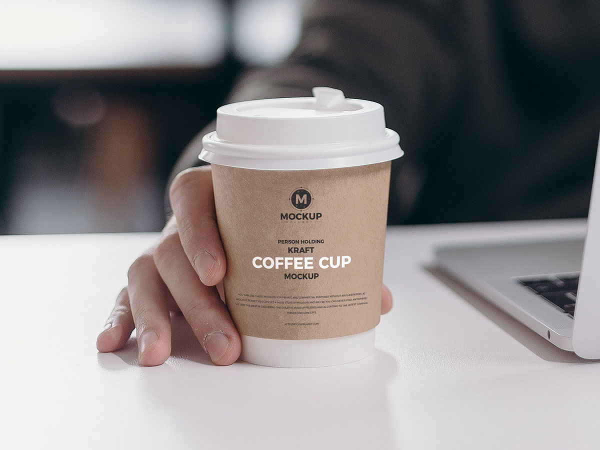 Download Free Person Holding Kraft Coffee Cup Mockup Design - Mockup Planet