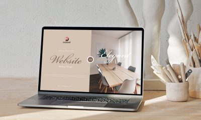 Free-Laptop-on-Wooden-Table-Website-Mockup-Design