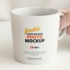 Free-Person-Holding-Mug-Logo-Mockup-Design
