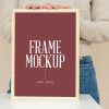 Free-Woman-Holding-Wooden-Frame-Mockup-Design